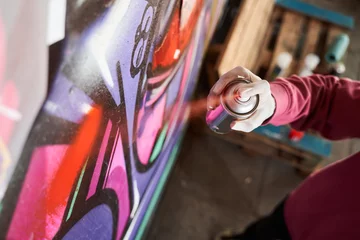 Foto op Aluminium Street artist painting colorful graffiti © Yakobchuk Olena
