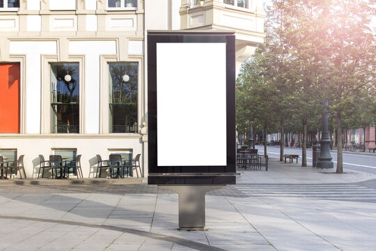 Mockup template of street lightbox stand signboard in the european city center.