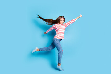 Full length body size photo flying super woman ready to rescue wearing casual outfit isolated vibrant blue color background