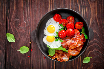 Traditional american breakfast with bacon and eggs