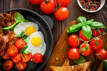 Traditional american breakfast with bacon and eggs