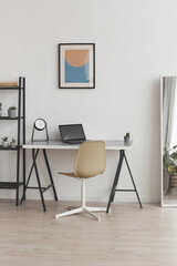 Vertical background background of minimal home office workplace in modern apartment decorated by...