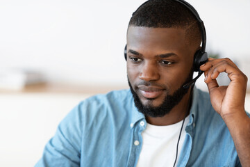 Closeup Portrait Of Handsome Black Male Hotline Operator In Headset