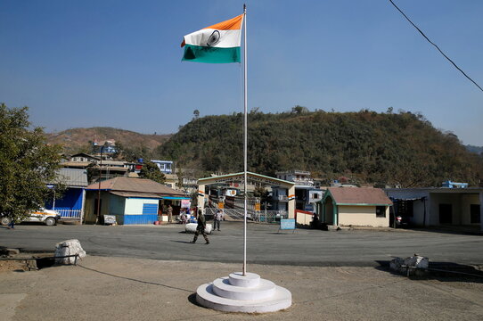 An Indian national flag flies next to an immigration check post on the India-Myanmar border in Zokhawthar village