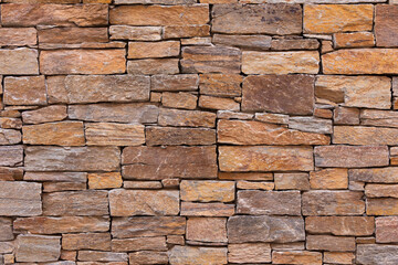 Photography of texture and background of stones on the facade of a renovated house in Ambel, a small town in the Campo de Borja region, Zaragoza, Aragon, Spain.