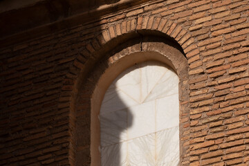 Photograph of a window in the church of Our Lady of the Rosary, of baroque mudejar architecture style, in the small town of Ambel, in the Campo de Borja region, Zaragoza, Aragon, Spain.