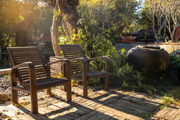 Autumn morning with wooden chairs  on corridor in garden