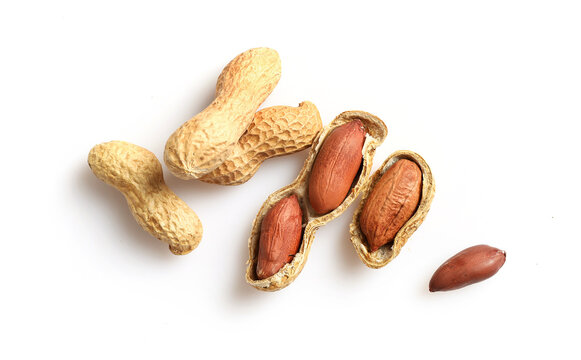 Unpeeled peanuts in nutshell isolated on white