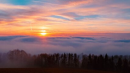 Fototapeta na wymiar Beautiful sunset above the clouds near Kostenz, Bavarian forest, Bavaria, Germany