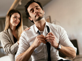 Young man having a problem. Girlfriend comforting her sad boyfriend..