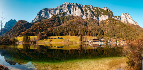 High resolution stitched panorama of a beautiful alpine autumn or indian summer view with reflections at the famous Hintersee, Ramsau, Berchtesgaden, Bavaria, Germany