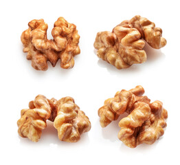 Set of golden walnut kernels isolated on white