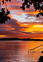 Deep orange sunset in autumn at lake Balaton.
