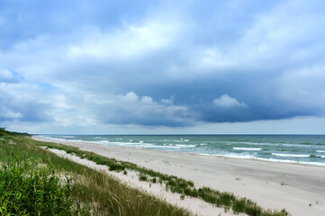 A deserted sea coast in bad weather. A seashore without people.