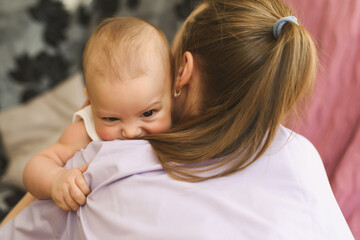 Young mother and her baby close-up. Happy family concept.