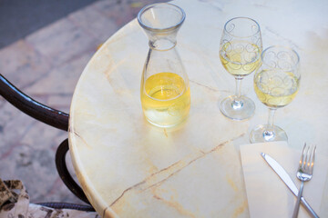 White wine in a liter bottle on a table in a cafe