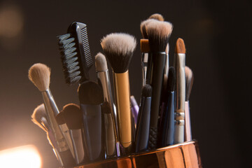 Close up photo of Makeup brushes with Bokeh