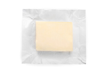 Block of fresh butter isolated on white background.