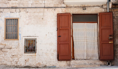Fototapeta na wymiar old door in old wall 