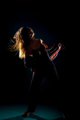 Modern style dancer  isolated on dark background