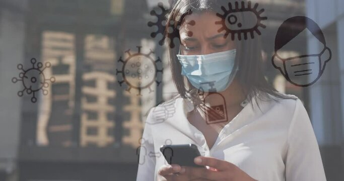 Animation of covid 19 icons over woman using smartphone wearing face mask