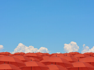 Many red umbrellas with a sky background.3d rendering illustration.