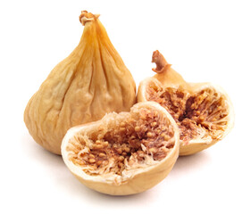 Whole and half figs are isolated against a non-white background.