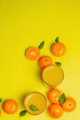 Sweet fruit jelly from fresh oranges and tangerines on summer yellow background