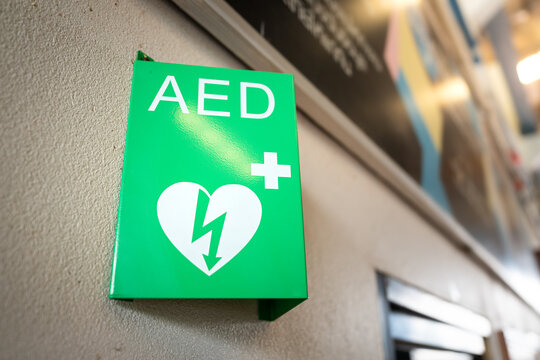 AED station sign in metallic green color plate, equipment using as medical treatment for heart attack incident. Sign and symbol object for Healthcare.
