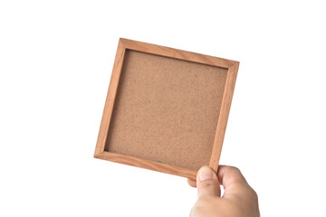 Hand and square wooden frame on white background.