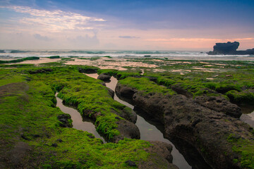 Indonesian temple in sea with tourist. Tanah lot complex. Bali. Indonesia