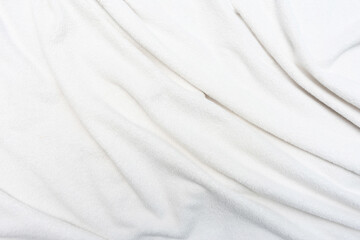Fototapeta premium White crumpled plaid, texture, top view