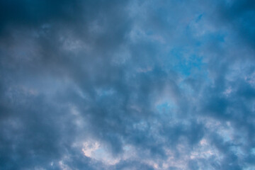Stormy grey sky with fluffy clouds, abstract background