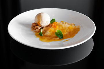 French crepe with fresh sweet orange sauce and ice cream. Top view