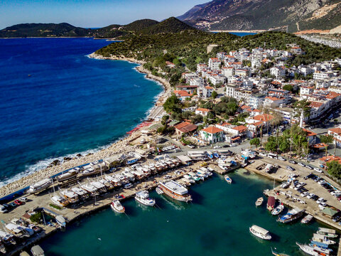 The top view from the drone of Kas resorts and city with amazing blue and clear lagoon and yachts in Mugla province of Turkey © Aleksey