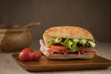 Ham sandwich on ciabatta bread.