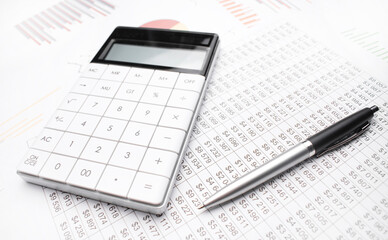 Naklejka na ściany i meble Financial accounting Pen and calculator on balance sheets
