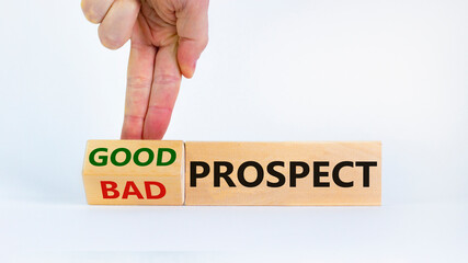 Good or bad prospect concept. Businessman turns a block and changes words 'bad prospect' to 'good prospect'. Beautiful white background. Business, good or bad prospect concept. Copy space.