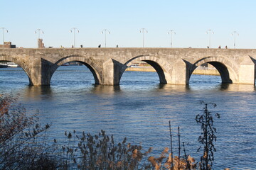 Part of the historic St Servaas bridge (Saint Servatius bridge) over the river Meuse in Maastricht on a sunny winter day