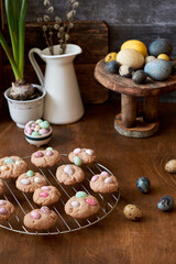Cinnamon cookies, Easter eggs, colorful chocolate eggs. Side view.