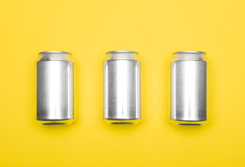 Aluminum cans on yellow background template