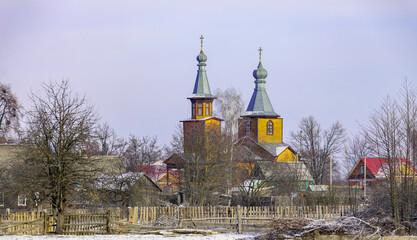 View of the outskirts of a Belarusian village in January after a morning snowfall.