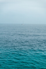 view on yacht boat in rainy overcast sea