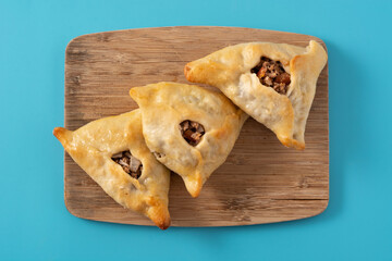 Traditional middle eastern fatayer on blue background