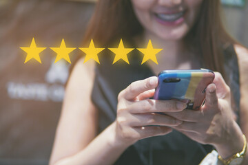 Concept of customer review or feedback, people use smartphone with 5 Star icon, Customer review good rating.