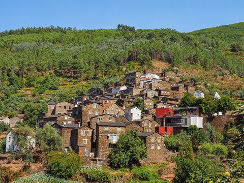 Small medieval Portuguese town. Famous village Pi&oacute;d&atilde;o, built of dark stones, is located on a hillside in the mountains Serra do A&ccedil;or, Portugal. Old city is popular tourist destination.