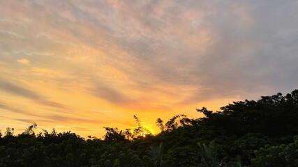 tropical sunset with cloud striations