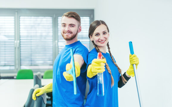Woman and man in commercial cleaner team