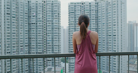 Woman looking at the city view from top