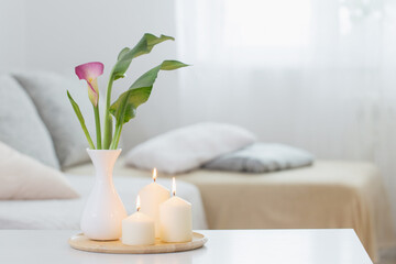 Fototapeta na wymiar flowers in vase on white table indoor